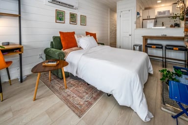 The living room converts into a bedroom w/ the sleeper sofa.